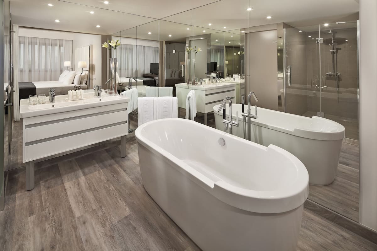 hair dryer, bathrobes, bidet, towels