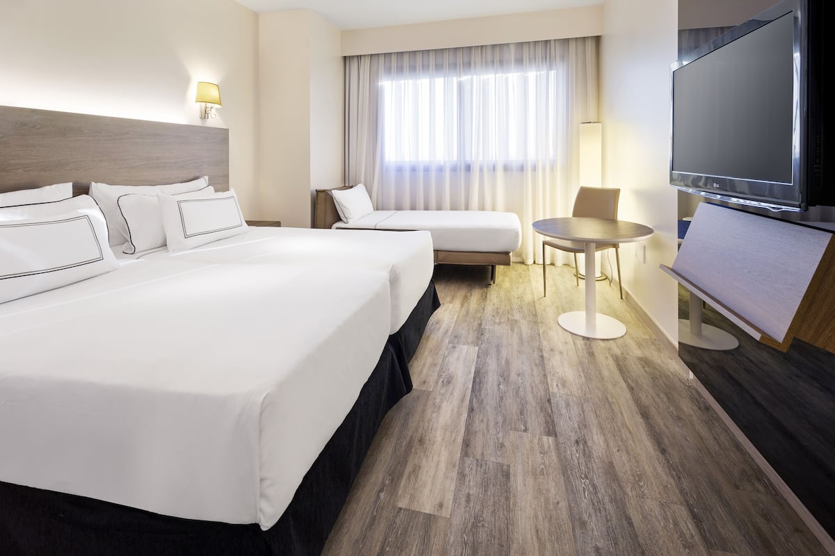 triple room (melia) | pillow-top beds, in-room safe, desk, blackout curtains