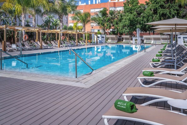 Seasonal outdoor pool, pool loungers, lifeguards on site