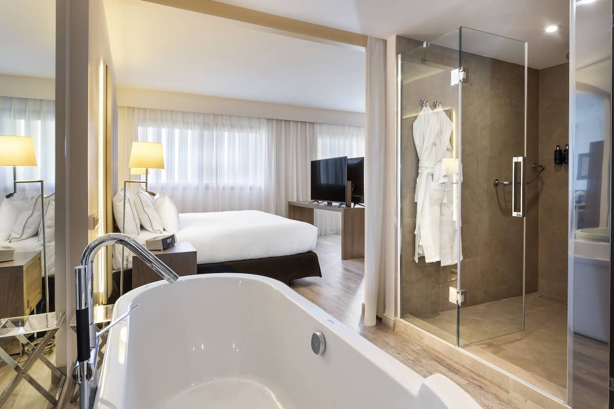 hair dryer, bathrobes, bidet, towels