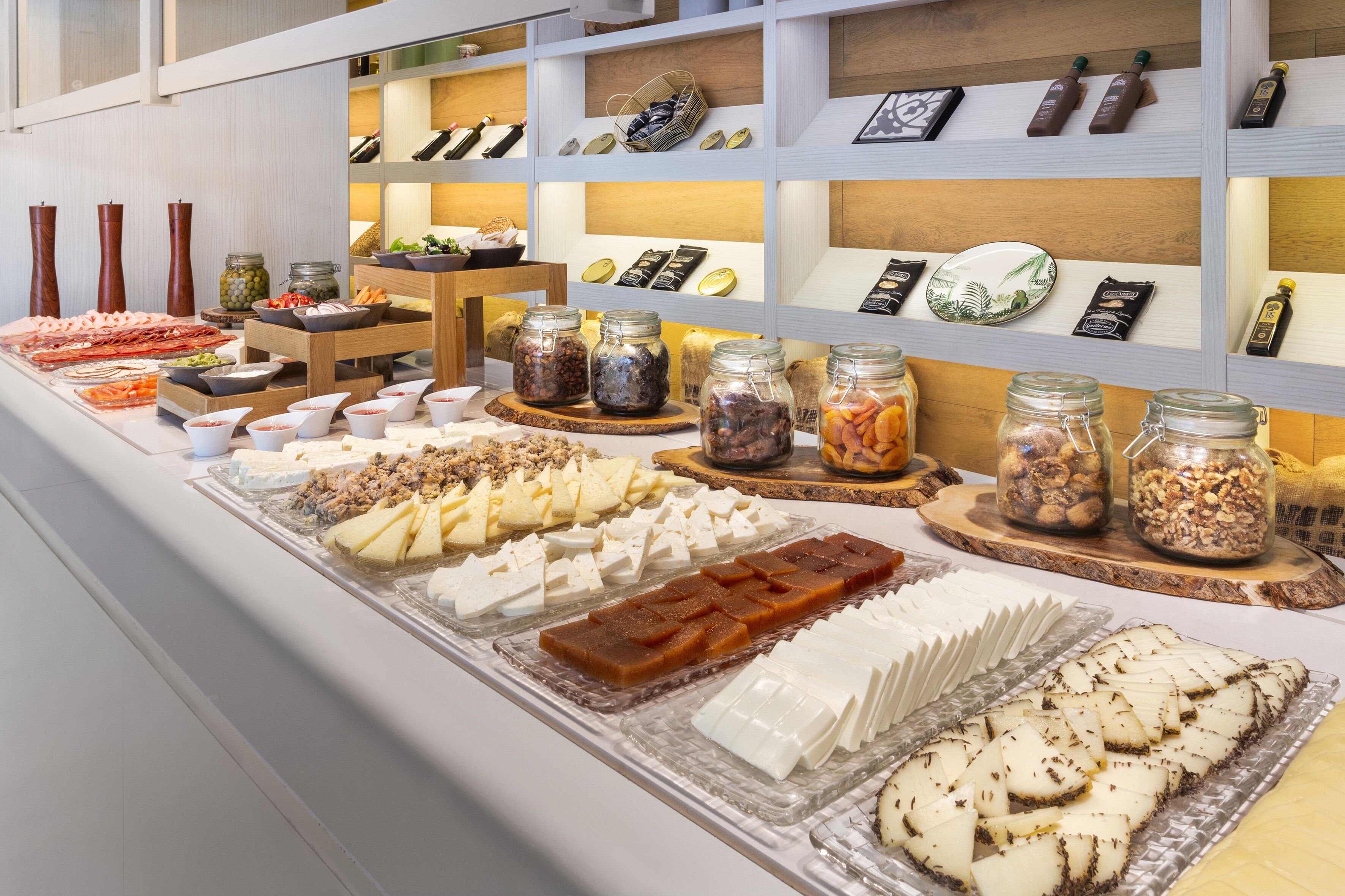 A buffet with various food items and condiments.