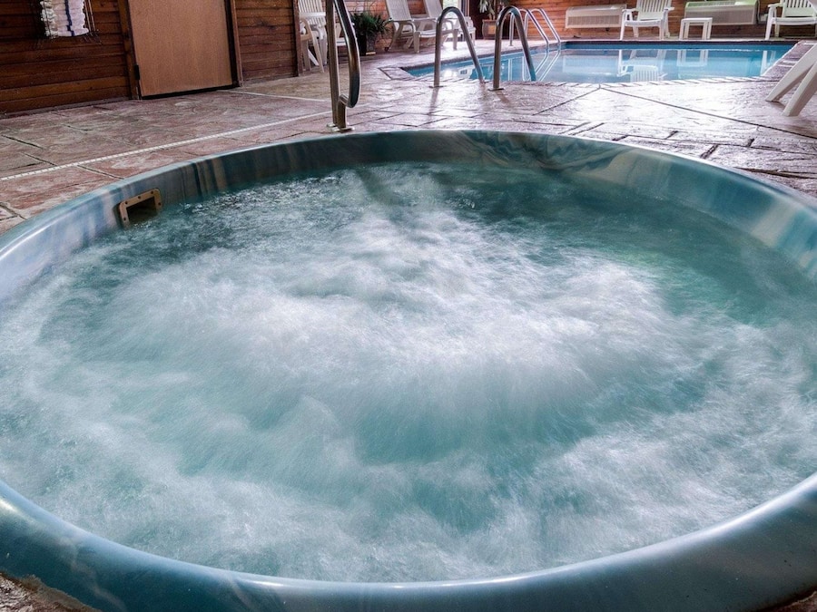 Indoor pool, open 9:00 AM to 10:00 PM, pool loungers