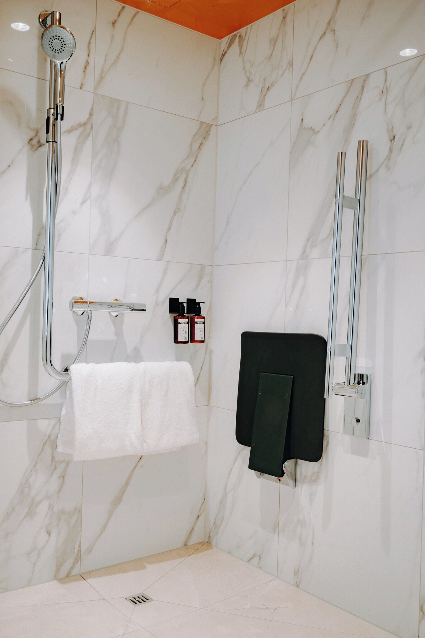 comfort room | bathroom | combined shower/bathtub, hair dryer, towels, soap