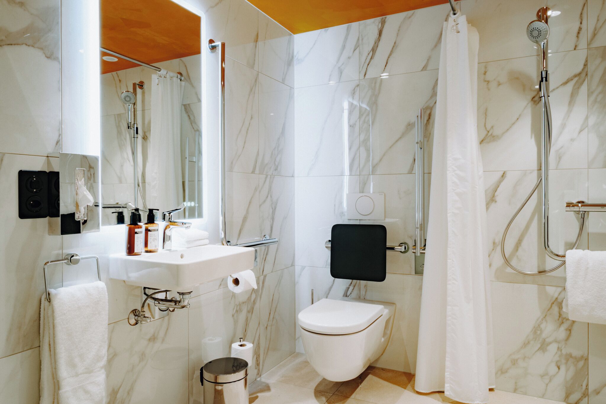 comfort room | bathroom | combined shower/bathtub, hair dryer, towels, soap