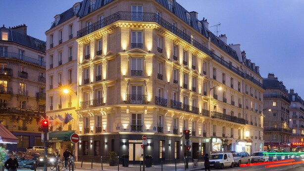 A multi-story hotel with a classic European architectural style, featuring balconies and a corner entrance. - Best Western Quartier Latin Pantheon (Paris)