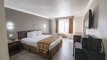 Deluxe Single Room, 1 Bedroom | Desk, laptop workspace, blackout curtains, iron/ironing board