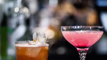 Two drinks on a bar counter.