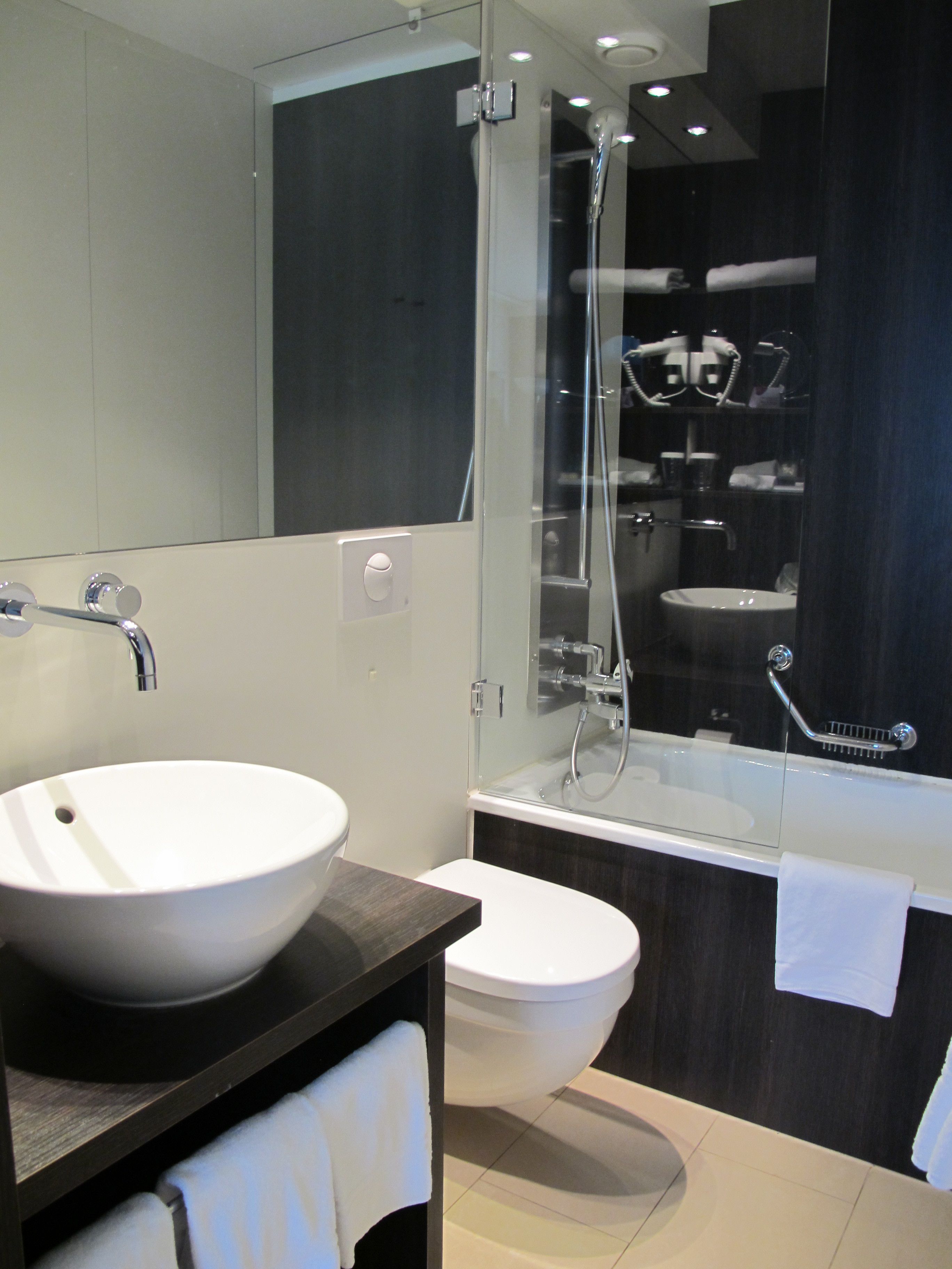 standard room | bathroom | rainfall showerhead, eco-friendly toiletries, hair dryer, bathrobes