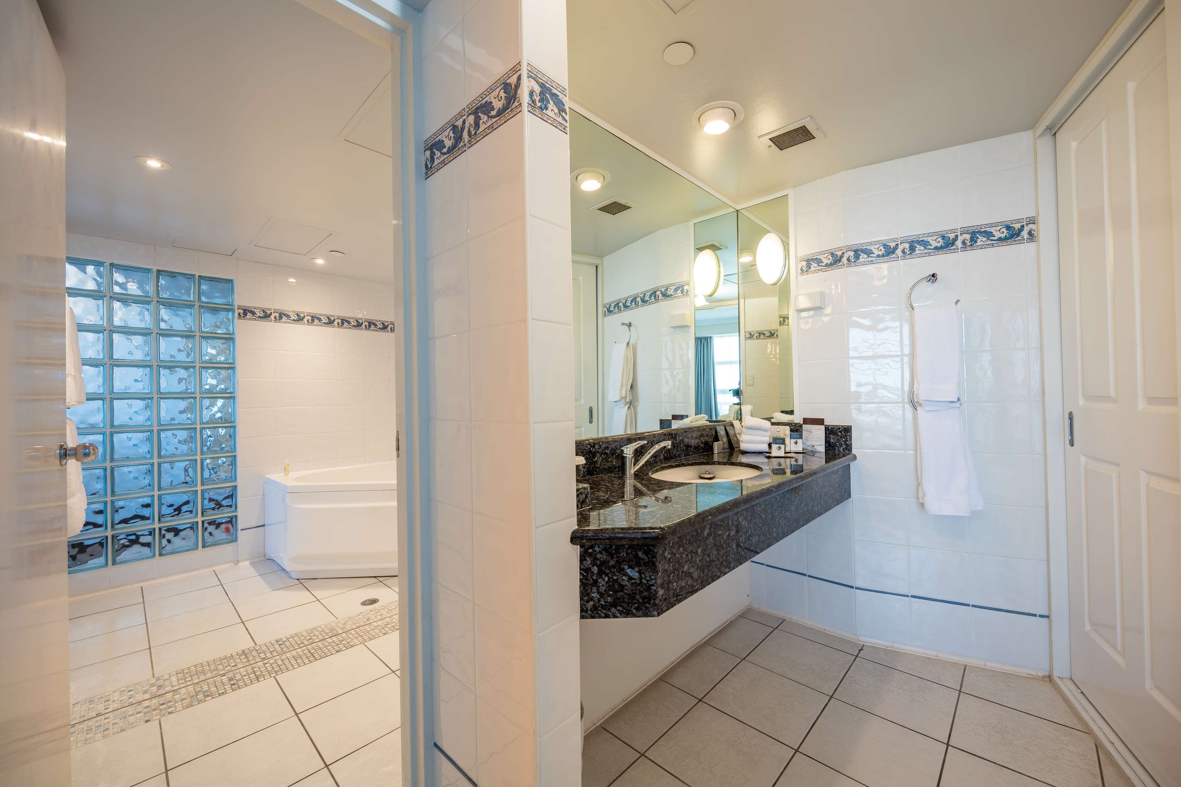 king one bedroom suite | bathroom | free toiletries, hair dryer, bathrobes, slippers