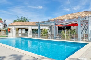 Outdoor pool, open 8 AM to 10 PM, pool umbrellas, sun loungers