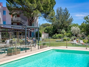 Outdoor pool, open 9:00 AM to 8:00 PM, pool umbrellas, pool loungers