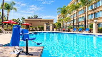 Outdoor pool, open 10:00 AM to 10:00 PM, pool loungers