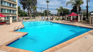 Outdoor pool, open 10:00 AM to 10:00 PM, pool loungers