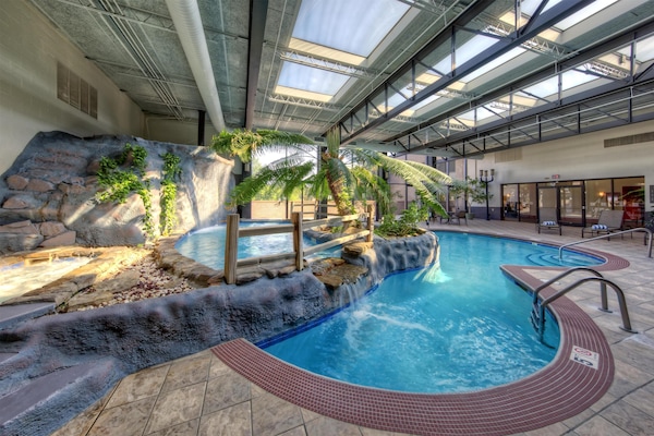 Indoor pool, open 6:00 AM to 11:00 PM, pool loungers