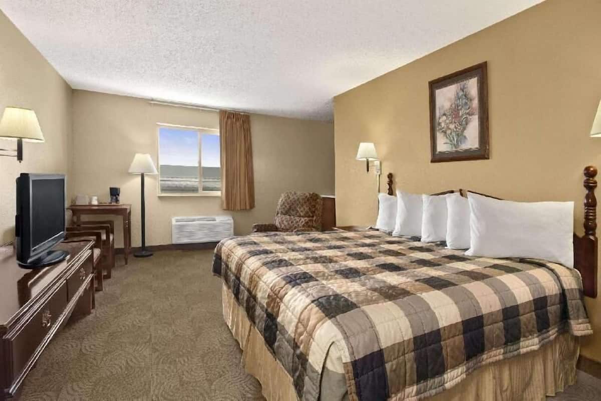 Desk, laptop workspace, blackout drapes, iron/ironing board