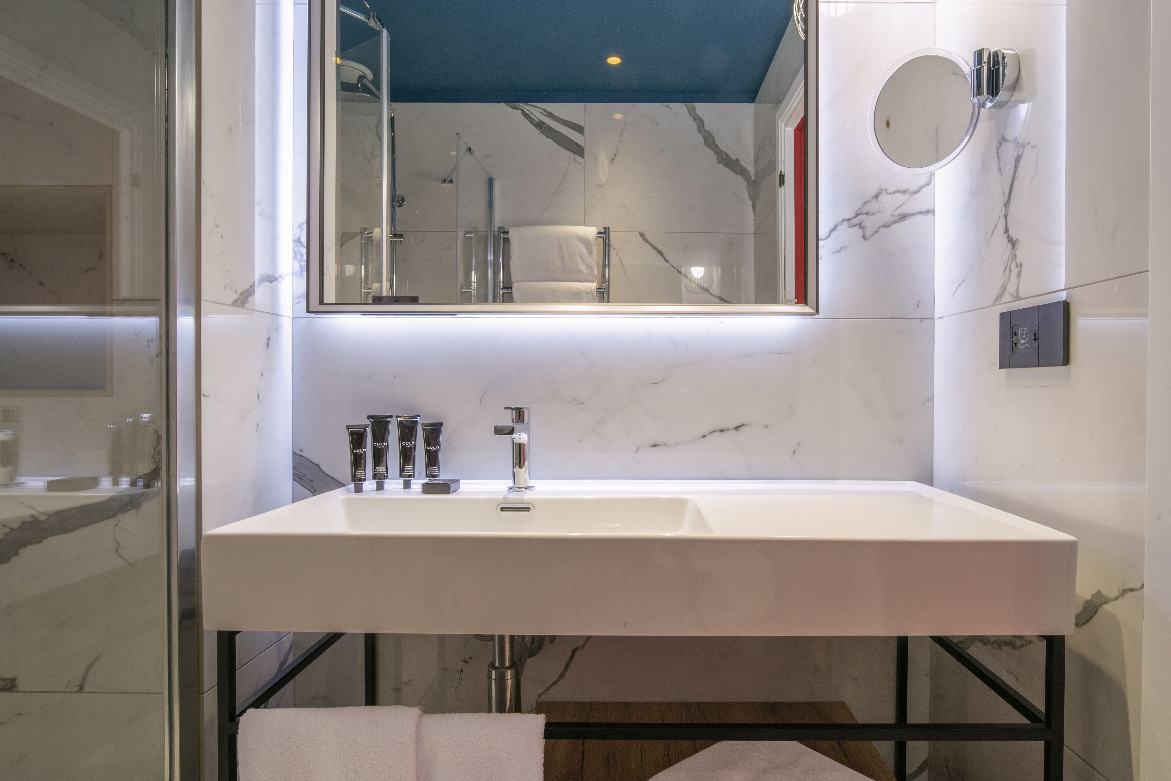 Eco-friendly toiletries, hair dryer, slippers, towels
