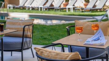 Seasonal outdoor pool, open 10:00 AM to 6:00 PM, free pool cabanas