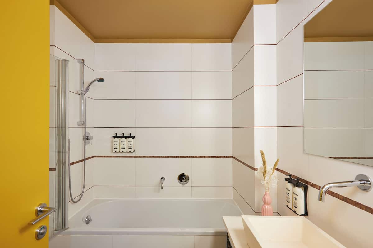 Eco-friendly toiletries, hair dryer, slippers, towels