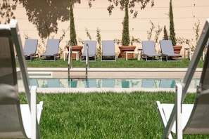 Seasonal outdoor pool, open 10:00 AM to 6:00 PM, sun loungers