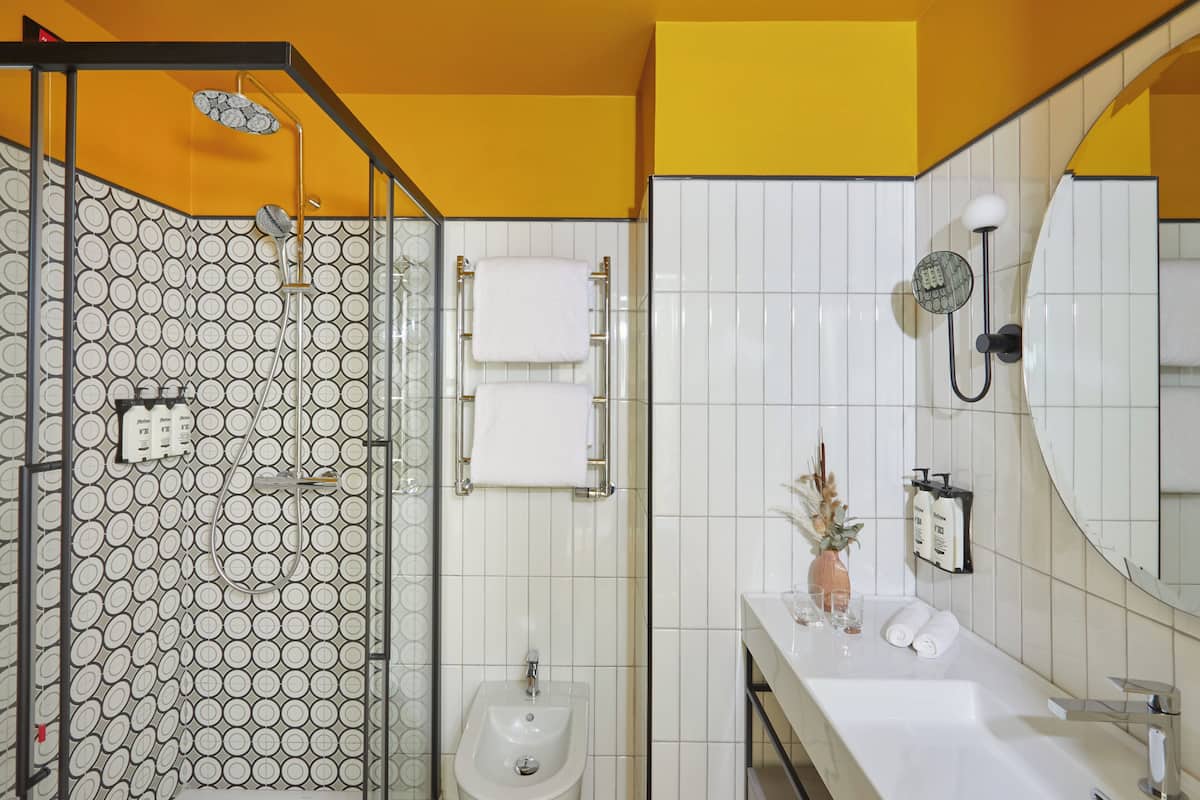 Eco-friendly toiletries, hair dryer, slippers, towels