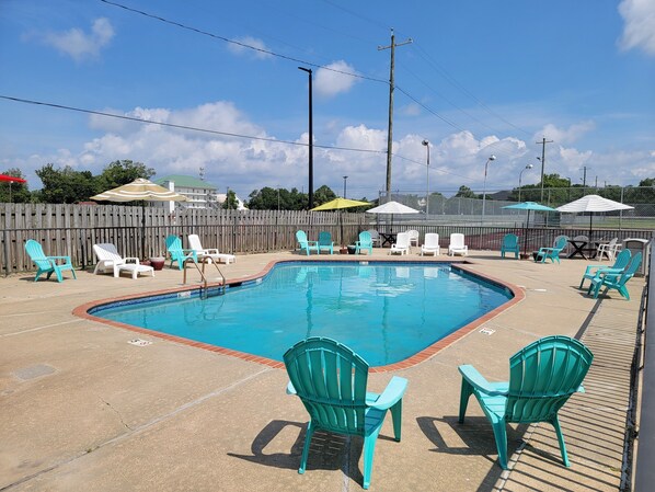 Seasonal outdoor pool, open 9:00 AM to 11:00 PM, pool umbrellas