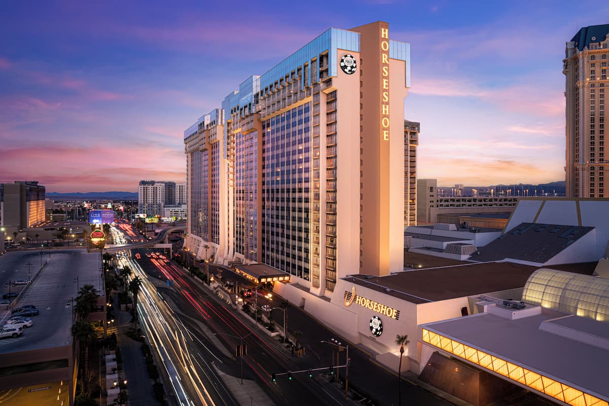 A high-rise hotel with a prominent sign reading "HORSESHOE" and a large logo.