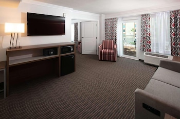 In-room safe, blackout drapes, iron/ironing board at Radisson Hotel Orlando Lake Buena Vista South