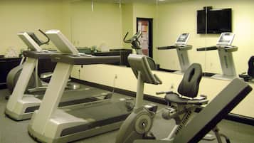 A fitness center with treadmills and a stationary bike.
