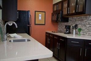 Full-sized fridge, microwave, stovetop, dishwasher