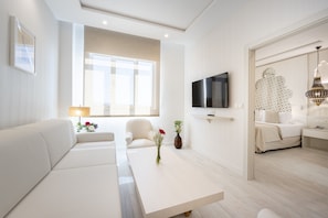 Junior Suite | Living area | 32-inch LCD TV with cable channels, TV