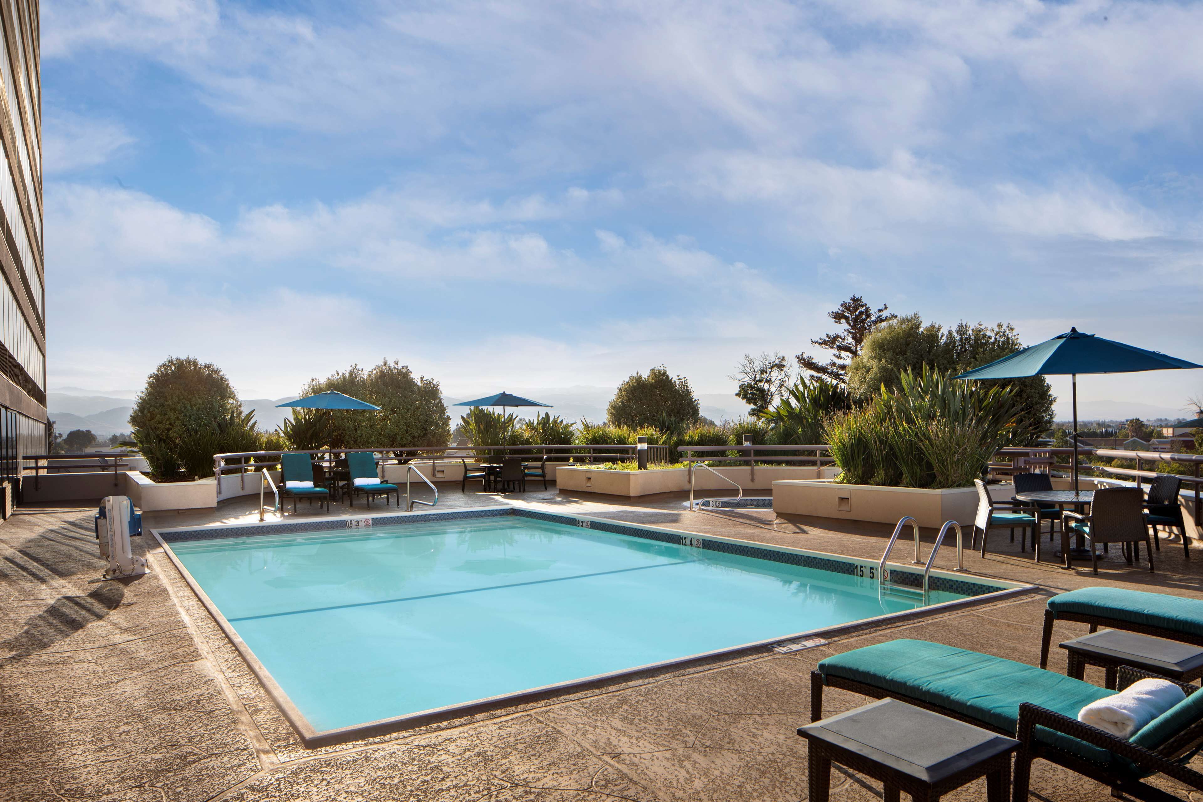 outdoor pool, open 7:00 am to 10:00 pm, pool umbrellas, pool loungers