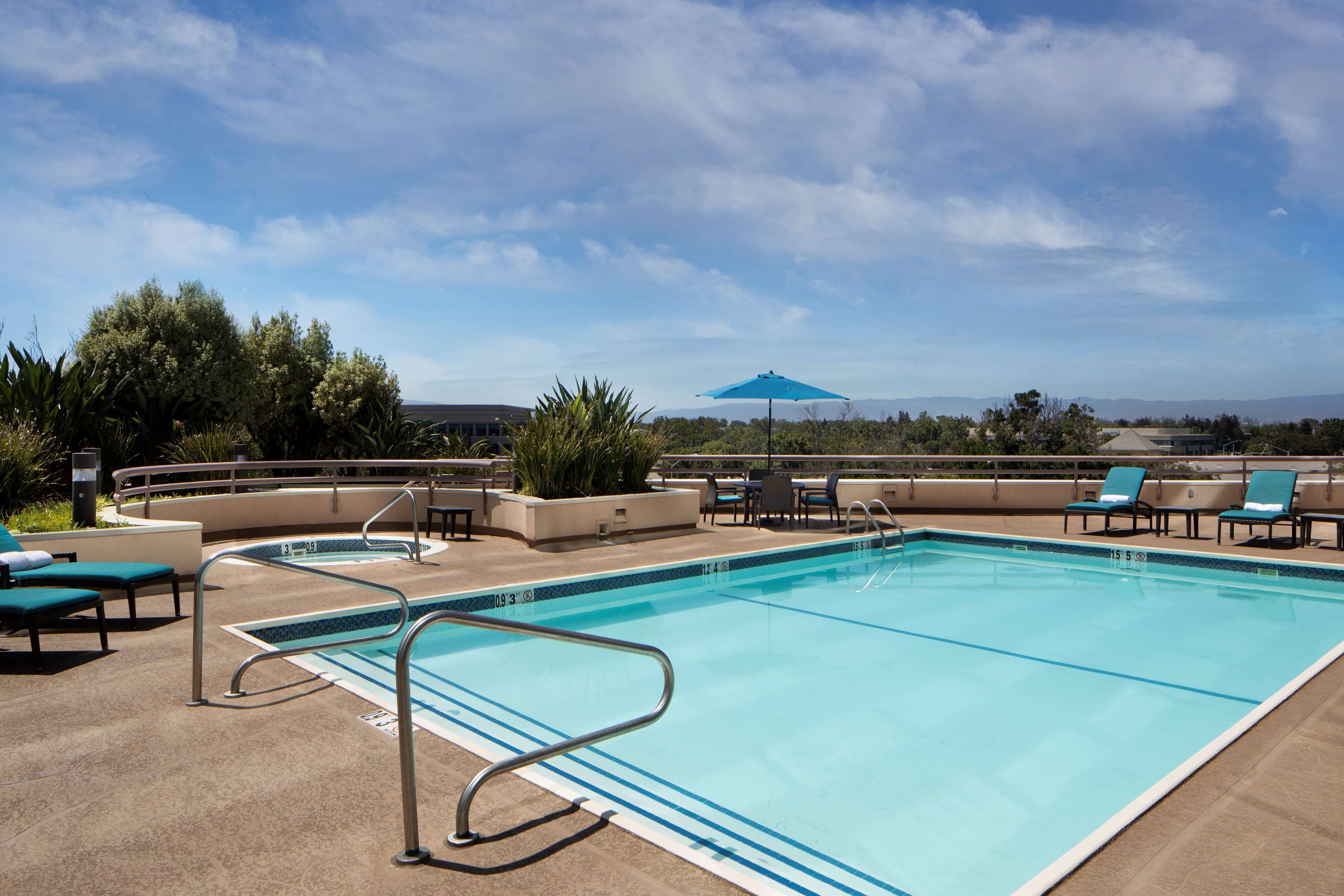 outdoor pool, open 7:00 am to 10:00 pm, pool umbrellas, pool loungers