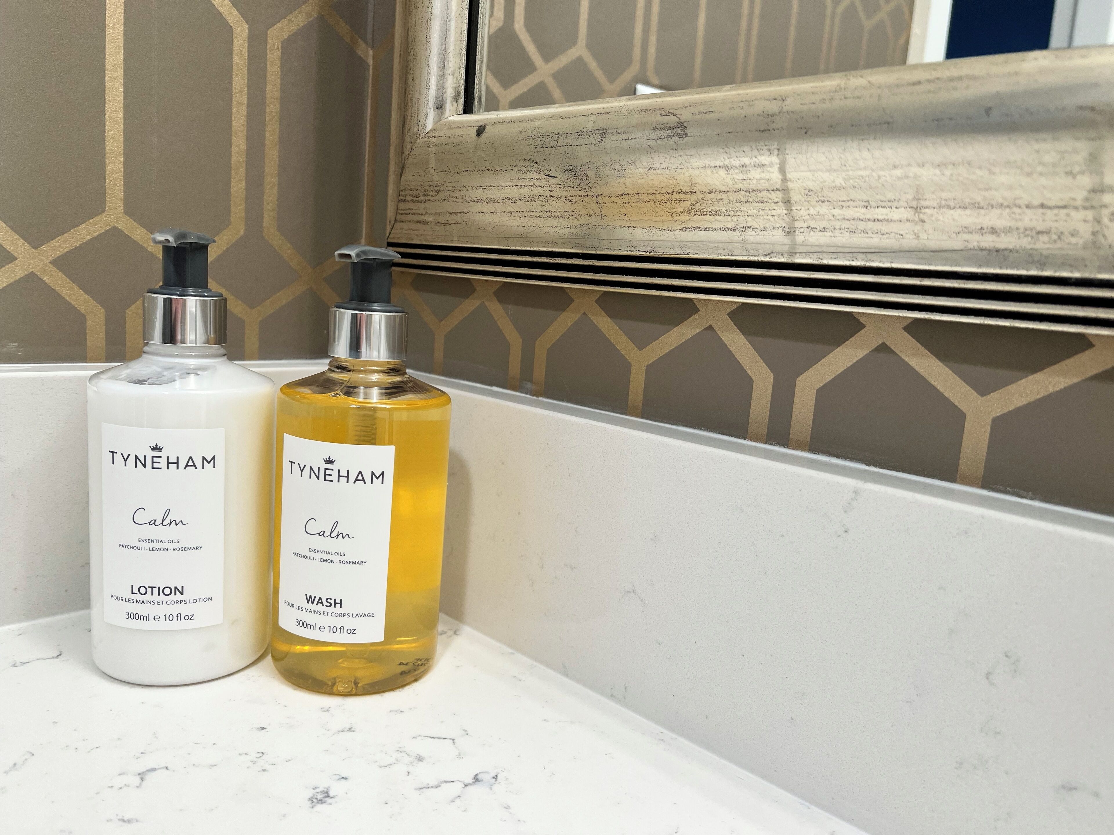 combined shower/bathtub, designer toiletries, hair dryer, towels