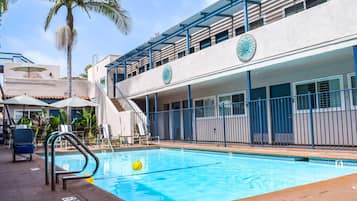 Outdoor pool, a heated pool, open 9:00 AM to 9:00 PM, pool umbrellas