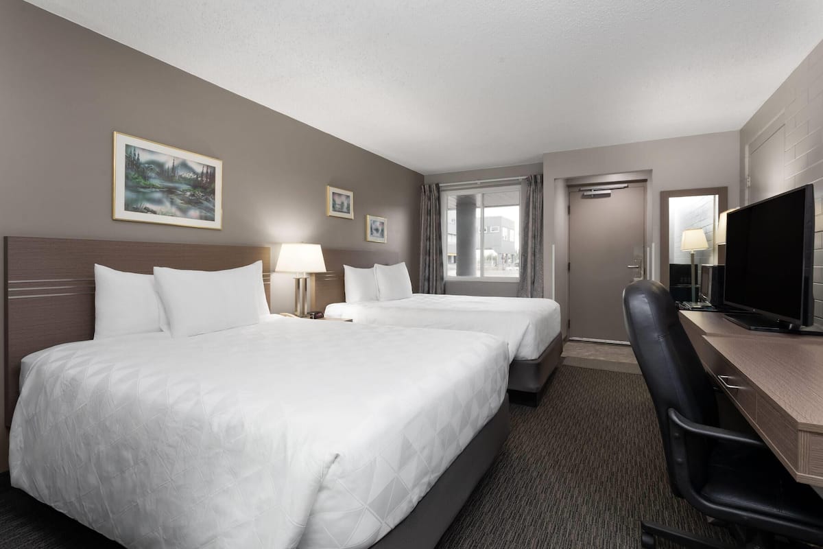 Room, 2 Queen Beds, Non Smoking, Ground Floor | Desk, blackout drapes, soundproofing, iron/ironing board