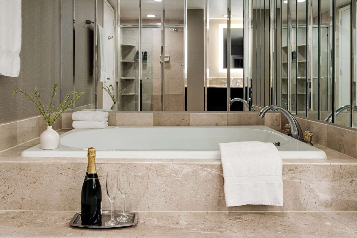 suite, 1 king bed, jetted tub | bathroom | eco-friendly toiletries, hair dryer, towels