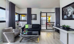 Suite, 1 Queen Bed, Non Smoking, Balcony | In-room safe, desk, soundproofing, iron/ironing board