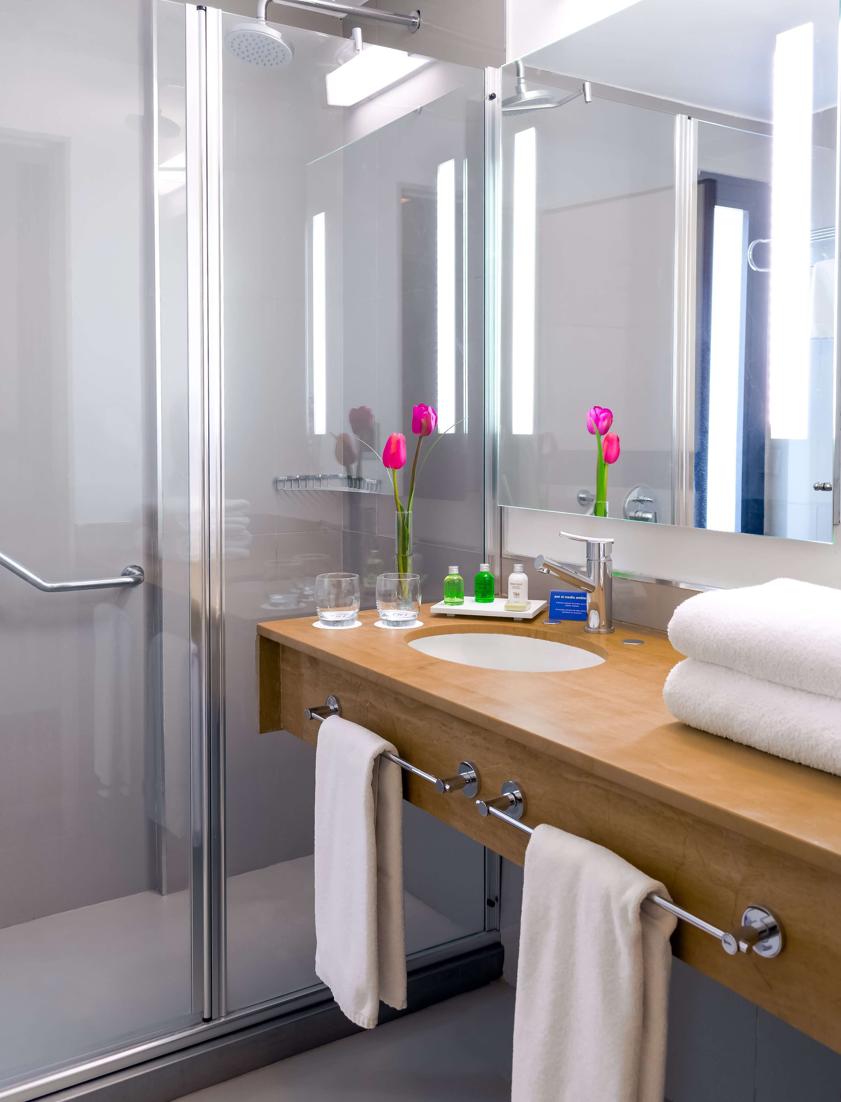 shower, eco-friendly toiletries, hair dryer, towels