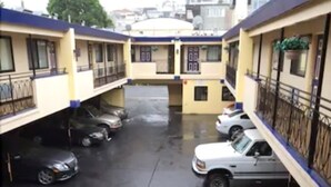 A multi-story parking garage with several cars parked. - Days Inn by Wyndham San Francisco - Lombard (San Francisco)
