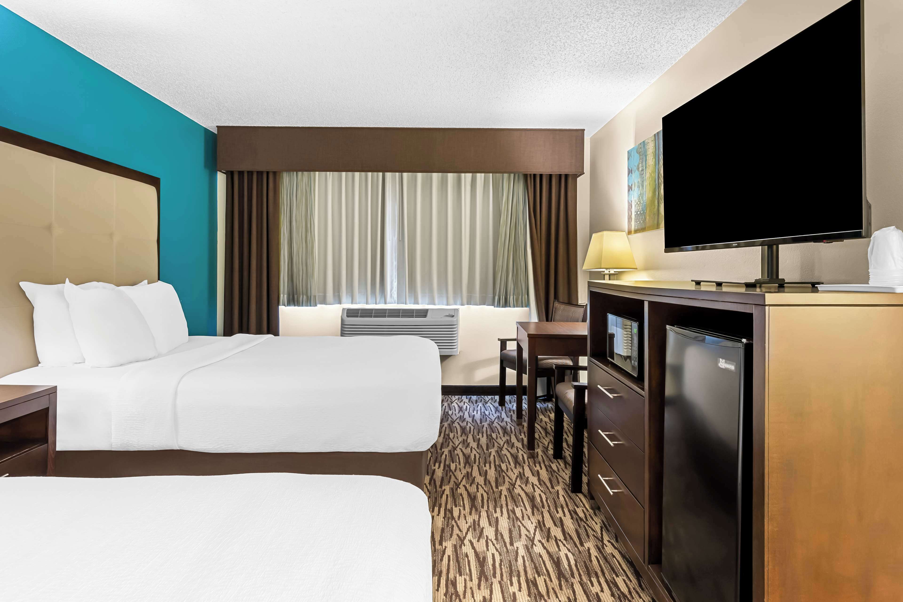 standard room, 2 queen beds, non smoking, refrigerator & microwave | blackout curtains, iron/ironing board, bed sheets