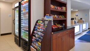A vending area with snacks and a beverage cooler. - Holiday Inn Express Towson - Baltimore North by IHG (Towson)