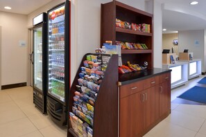 A vending area with snacks and a beverage cooler.