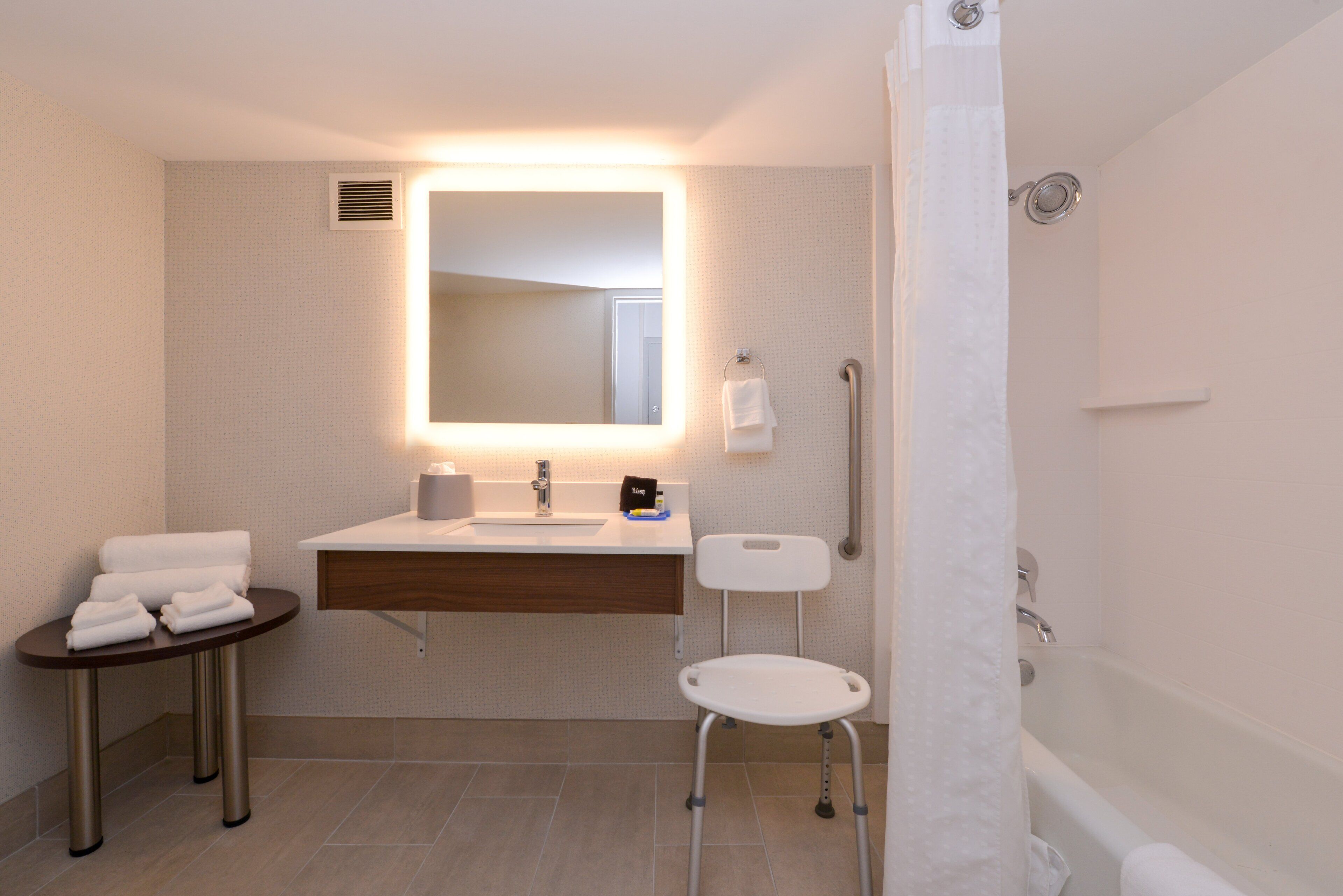 standard room, 1 king bed, accessible (hearing, mobility tub) | bathroom | designer toiletries, hair dryer, towels, soap