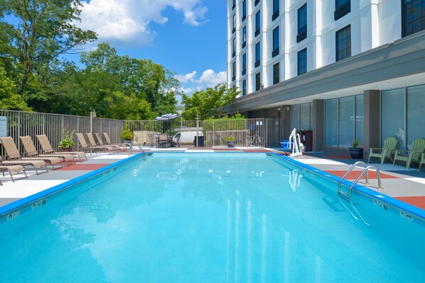 Seasonal outdoor pool, open 2:00 PM to 8:00 PM, pool umbrellas