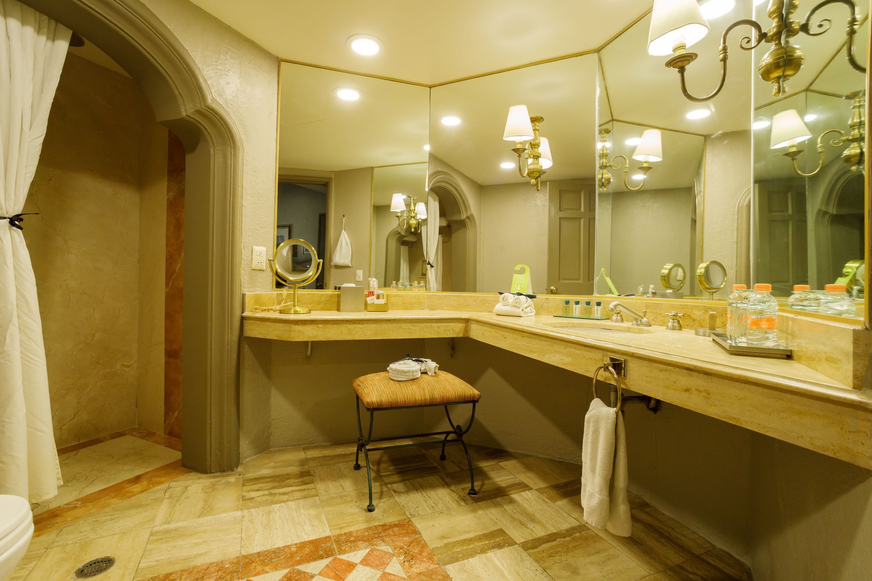 designer toiletries, hair dryer, bathrobes, slippers