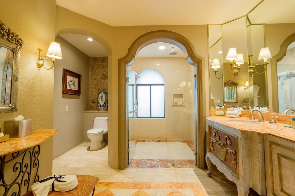 designer toiletries, hair dryer, bathrobes, slippers