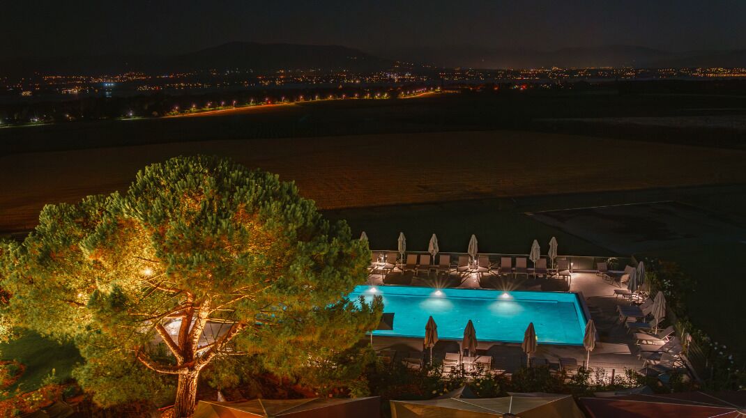 Seasonal outdoor pool, open 7:00 AM to 9:00 PM, pool umbrellas