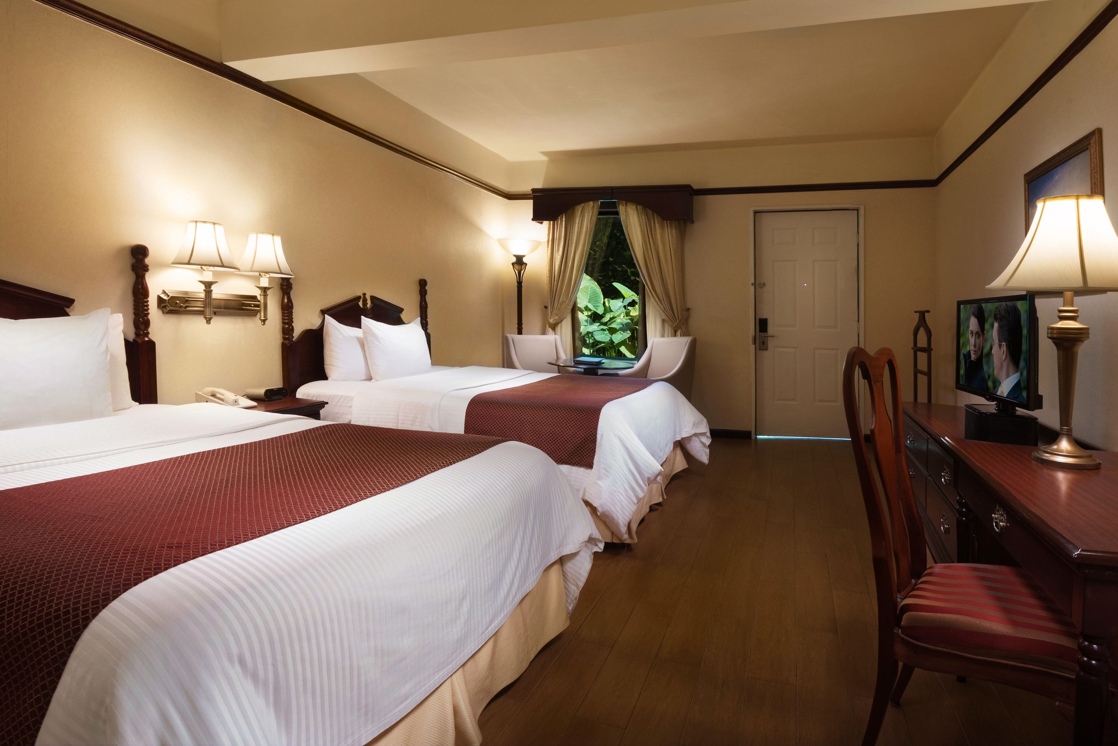 royal room, 2 queen beds | premium bedding, down duvets, pillow-top beds, desk