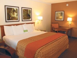 Premium bedding, desk, laptop workspace, iron/ironing board