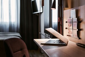Desk, blackout drapes, rollaway beds, free WiFi
